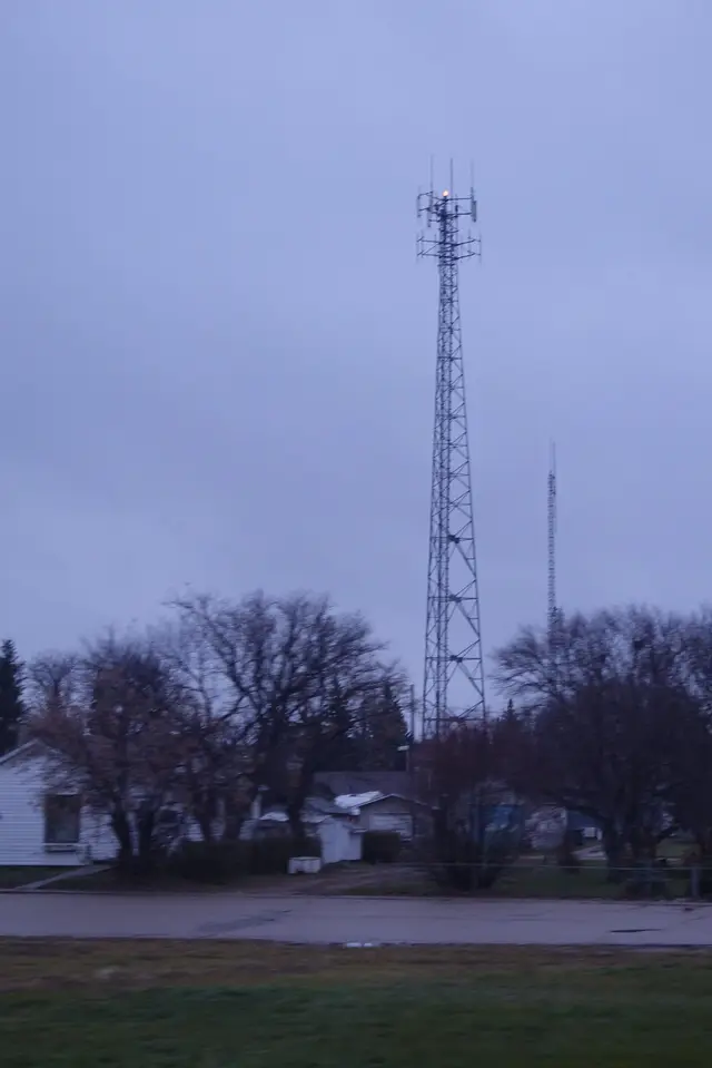 Cell tower above houses